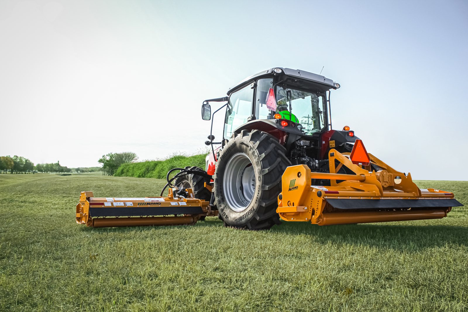 Alamo Interstater system with rear flail and side wing lowered, working a large grassed area